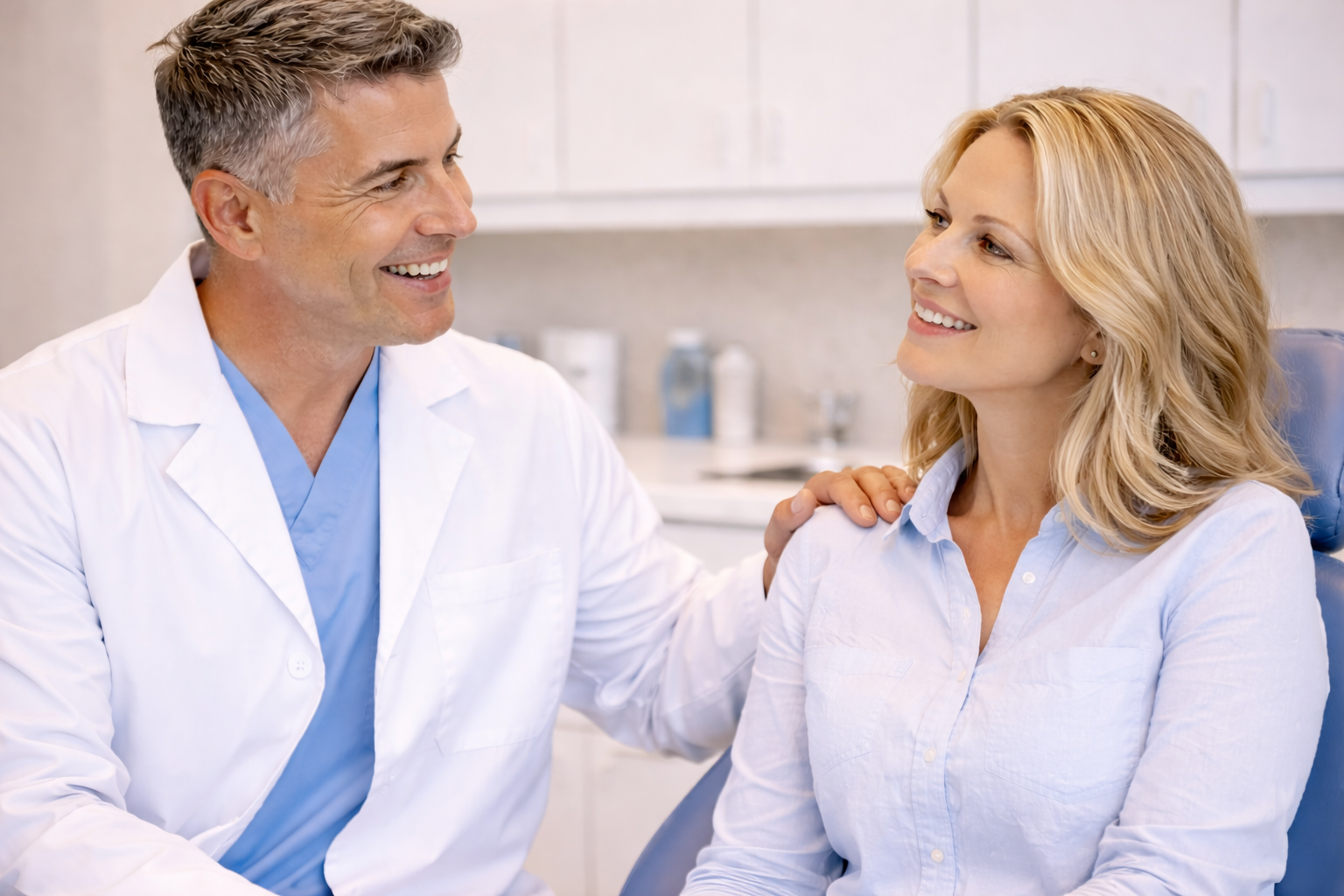 Dentist calmly explaining oral conscious sedation dentistry to a relaxed patient in a reassuring dental setting